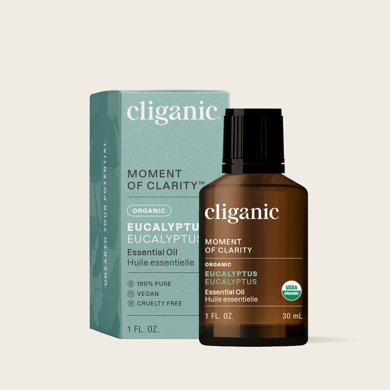 cliganic Eucalyptus Essential Oil bottle and packaging on a beige background. 1 oz / 30 ml. USDA Organic certified. 